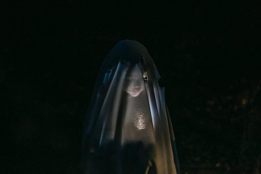 The Dark Storyteller: "Dušek" (part two), mysterious child shining flashlight on face covered with blanket