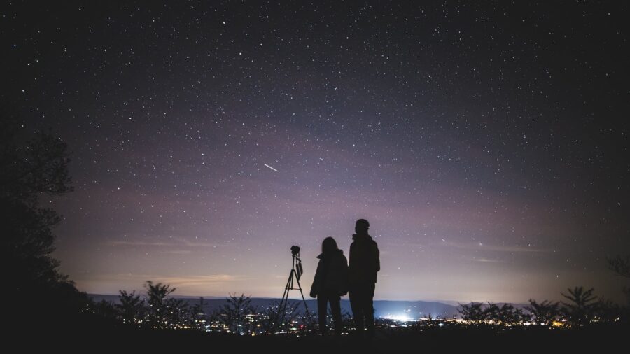 Dr. Wayne Dyer, silhouette of two persons stargazing